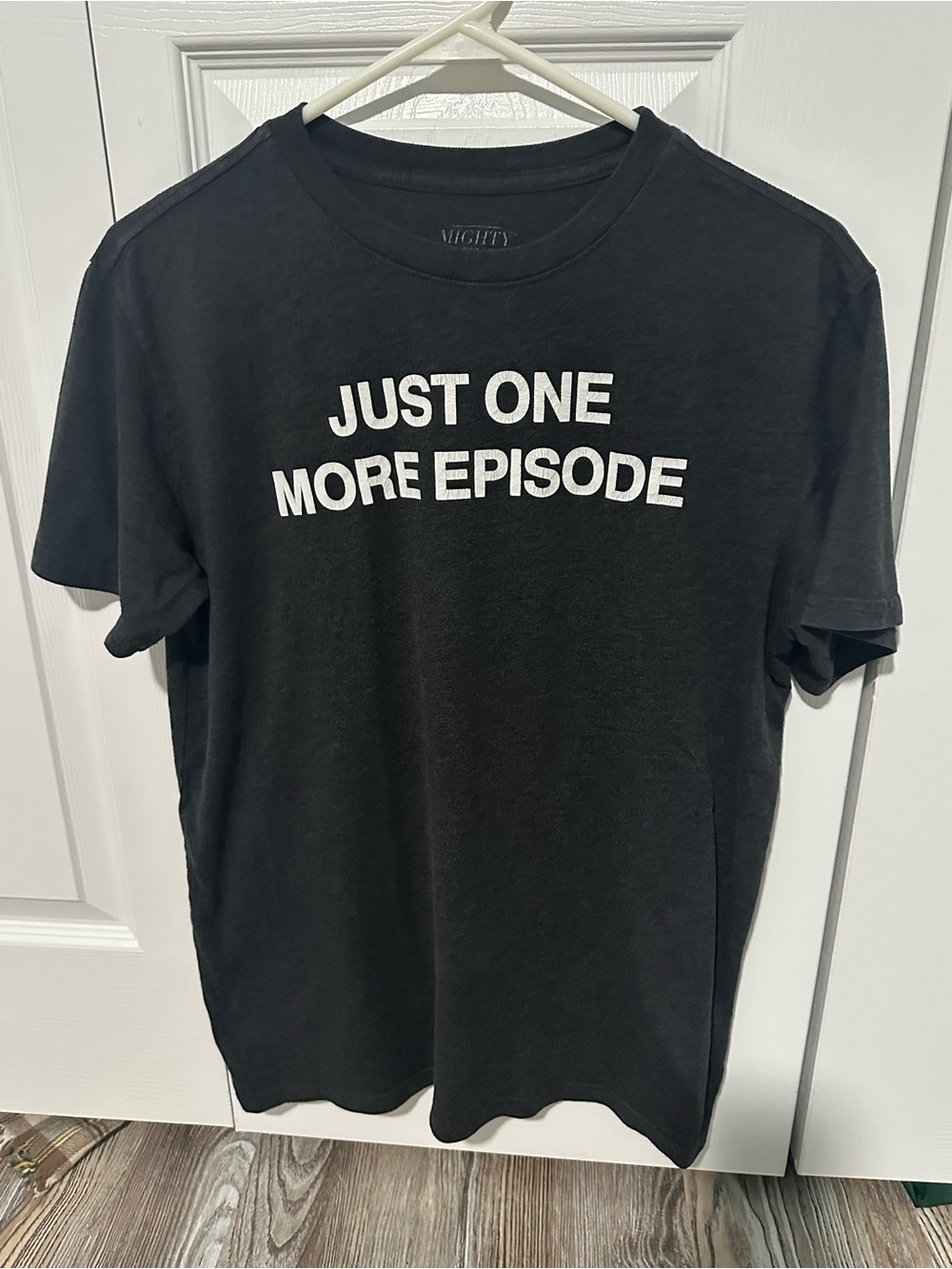 Mighty Fine Black Tee with White "Just One More Episode" Graphic
